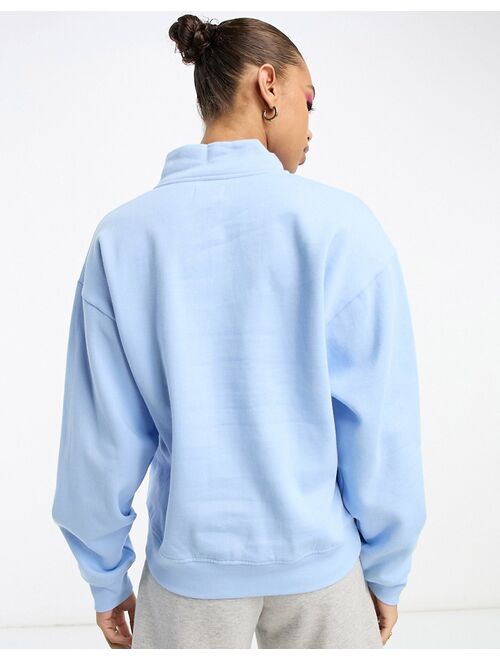 ASOS DESIGN half zip sweatshirt in sky blue