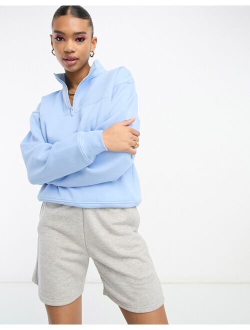 ASOS DESIGN half zip sweatshirt in sky blue