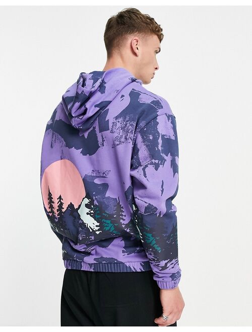 ASOS DESIGN oversized hoodie in purple with all over mountain print