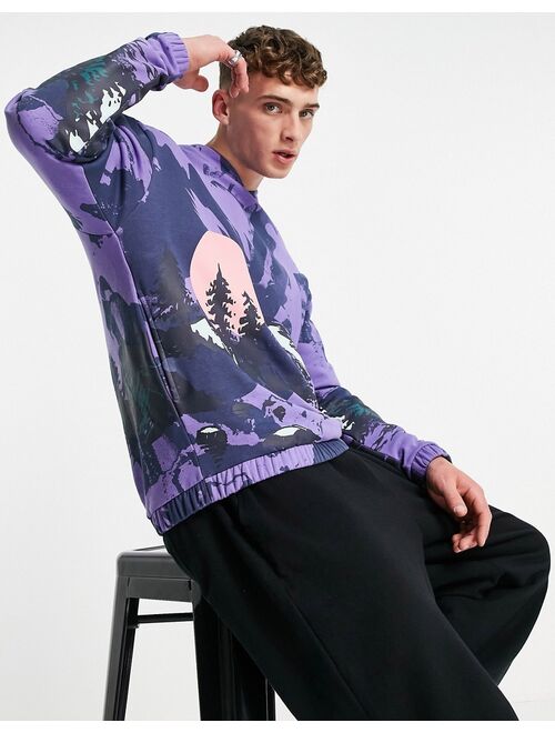 ASOS DESIGN oversized hoodie in purple with all over mountain print