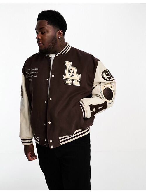 ASOS DESIGN oversized varsity bomber jacket in brown