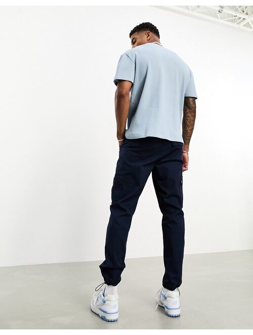 ASOS DESIGN tapered cargo pants in navy