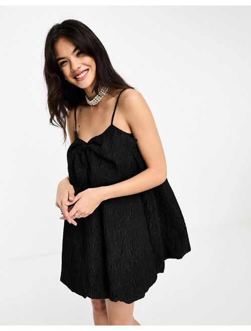 Sister Jane puffball bow jacquard mini dress in black