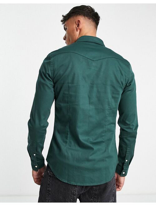 ASOS DESIGN skinny denim shirt in forest green