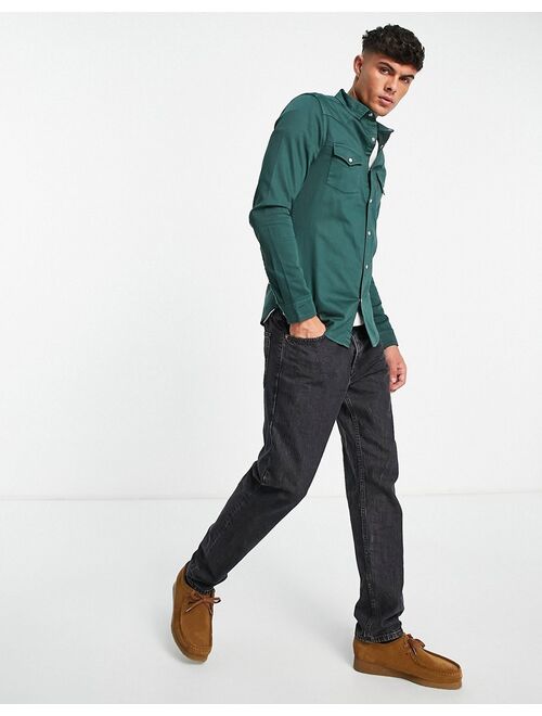 ASOS DESIGN skinny denim shirt in forest green