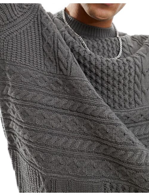 ASOS DESIGN knitted sweater with spliced cable detailing in charcoal