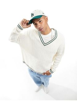oversized cable knit cricket sweater in cream with green tipping