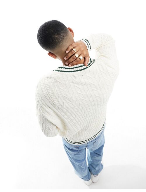 ASOS DESIGN oversized cable knit cricket sweater in cream with green tipping