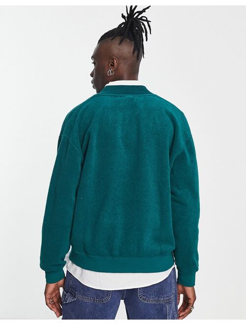 PUMA Team varsity fleece cardigan in green