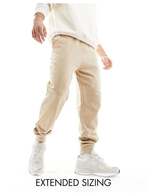 ASOS DESIGN tapered sweatpants in beige