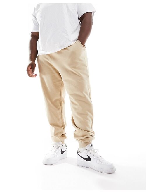 ASOS DESIGN tapered sweatpants in beige