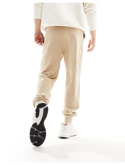 ASOS DESIGN tapered sweatpants in beige