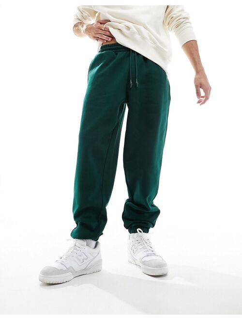 ASOS DESIGN oversized heavyweight sweatpants in dark green