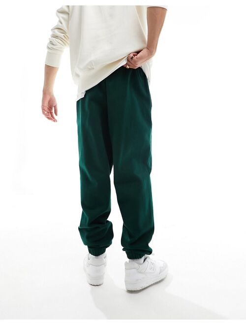 ASOS DESIGN oversized heavyweight sweatpants in dark green