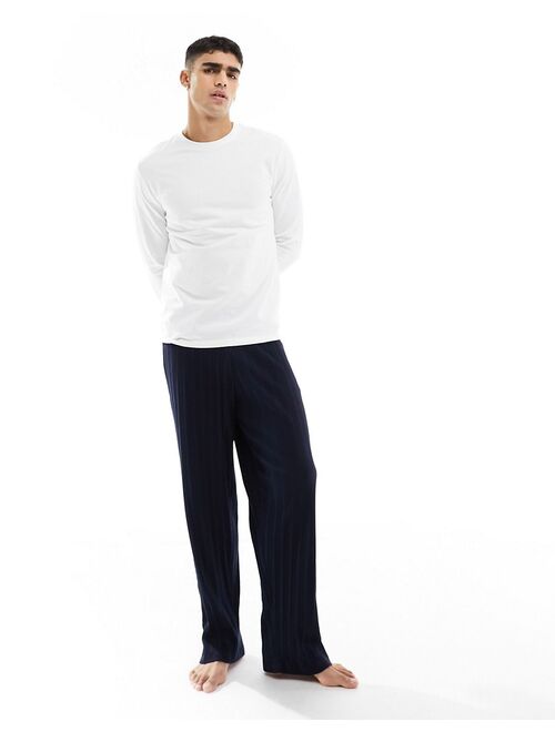 ASOS DESIGN pajama set with long sleeve white T-shirt and ribbed navy bottoms