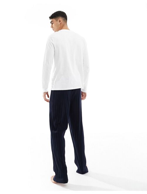 ASOS DESIGN pajama set with long sleeve white T-shirt and ribbed navy bottoms