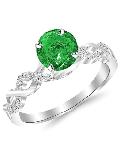 0.63 Carat 14K White Gold Twisting Infinity Gold and Diamond Split Shank Pave Set Diamond Engagement Ring with a 0.5 Carat Natural Emerald Center