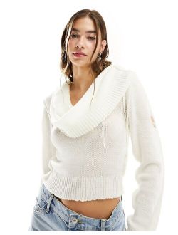 multi-wear knit sweater top with distressing in ecru